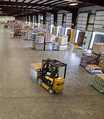 Someone driving a forklift in a factory